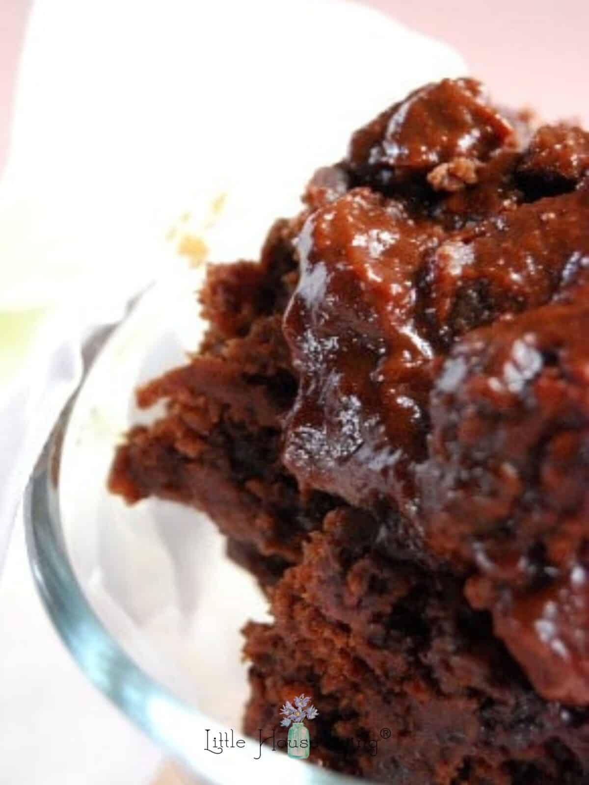 Closeup of chocolate molten lava cake in a glass dish.