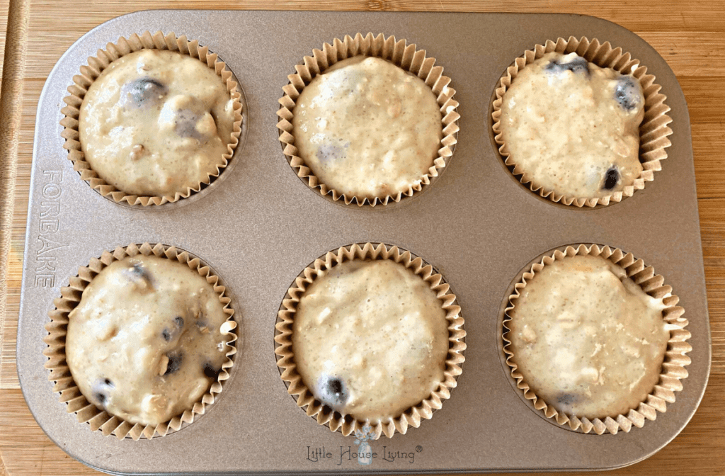 Muffin batter in the muffin cups.