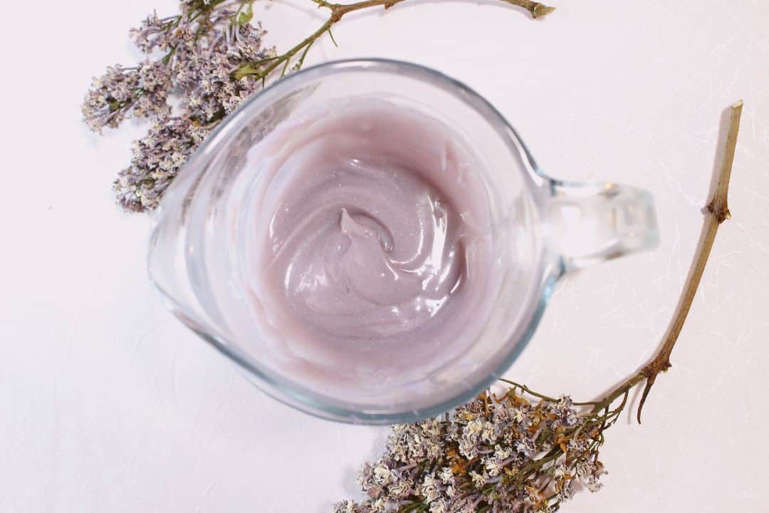 Lilac lotion in a glass jar