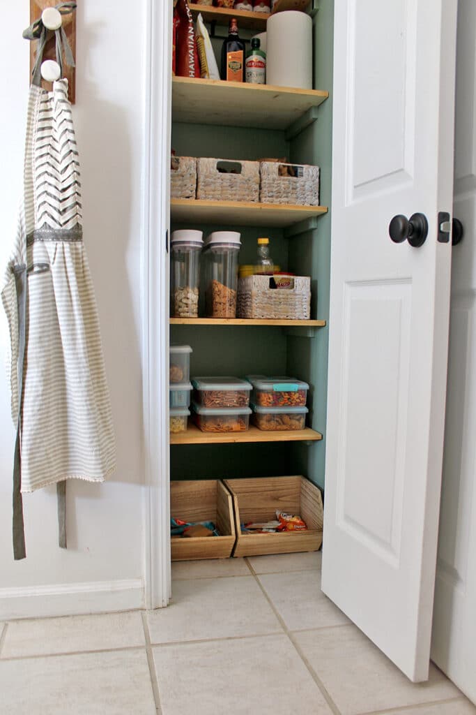 Kitchen pantry with apron beside 