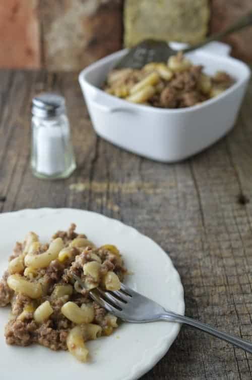homemade hamburger helper on a plate with more int he background
