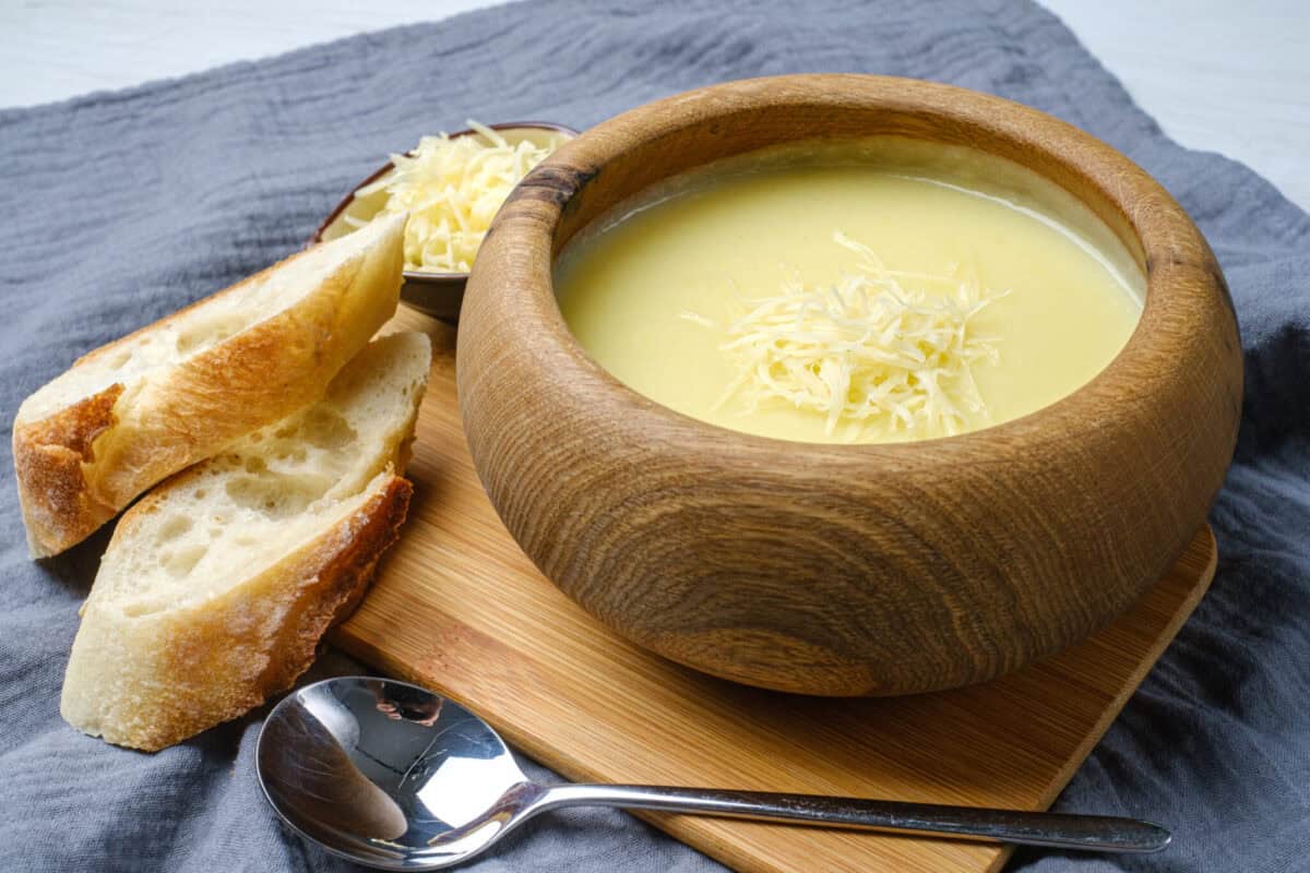 Creamy potato soup served with crusty bread, perfect for cozy family dinners.
